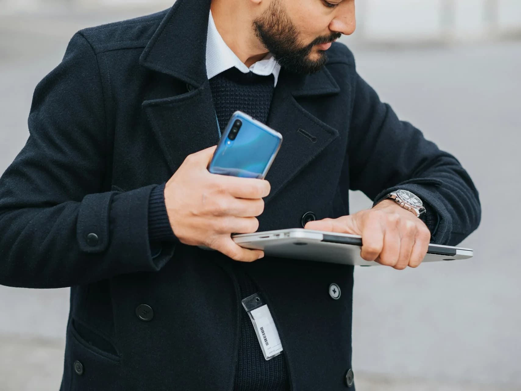 Checking a smartwatch and phone on the go